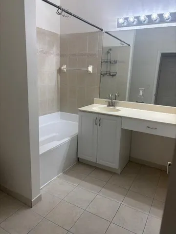a bathroom with a bathtub and a sink