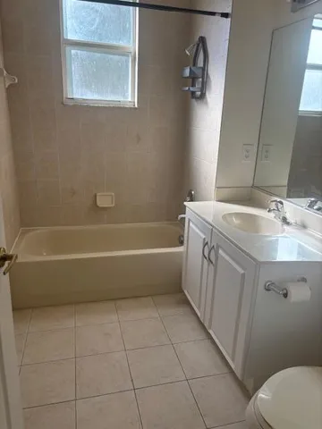 a view of an empty room and a window