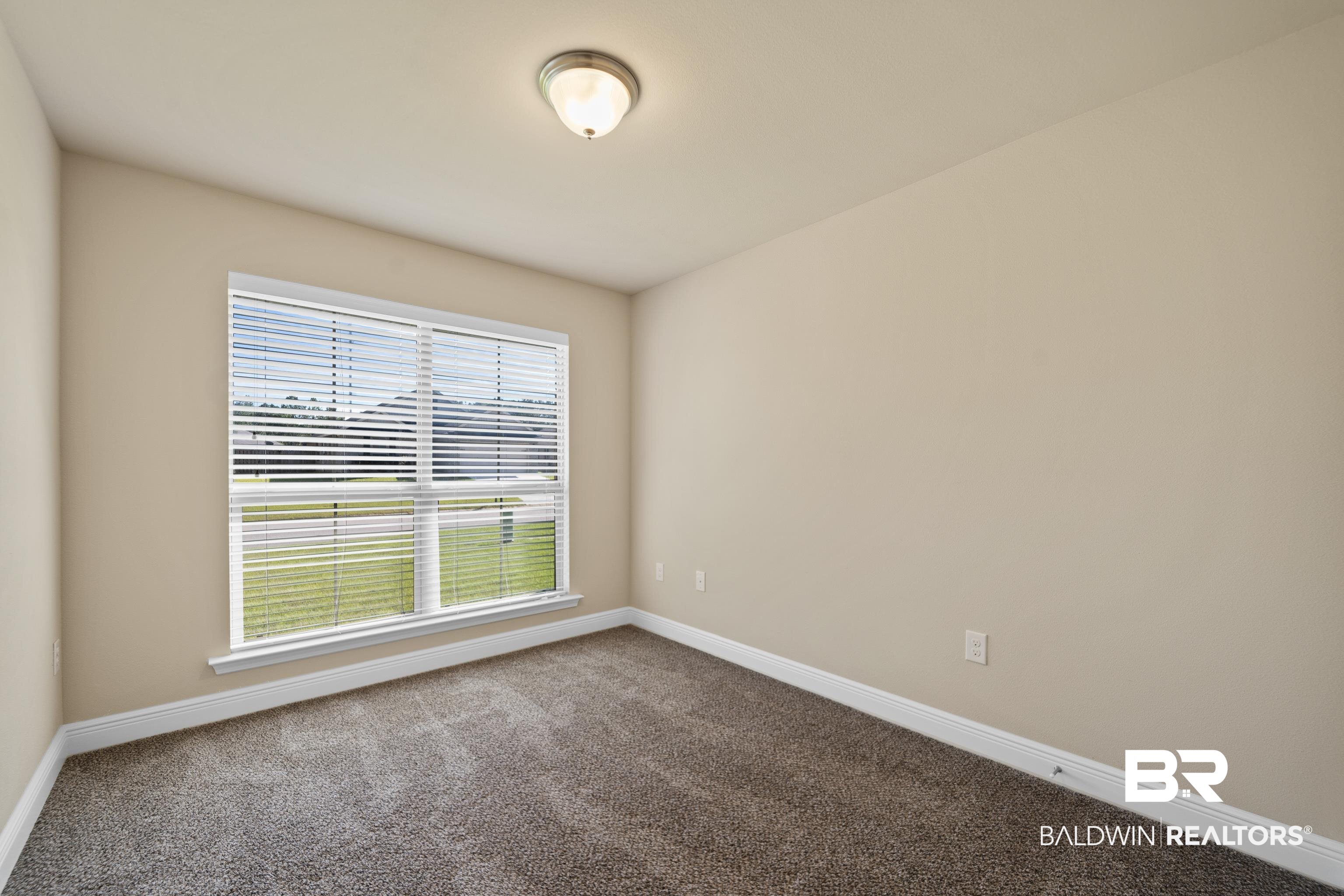 22631 Lake South Drive Foley, AL 36535 - Photo 17 of 25 Unfurnished room with carpet flooring