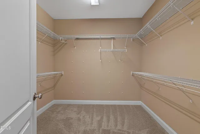 a bathroom with a sink vanity granite toilet and a mirror