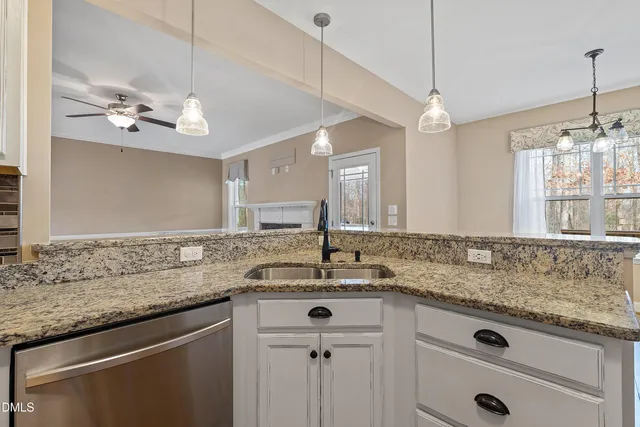 a view of a dining room with furniture and window