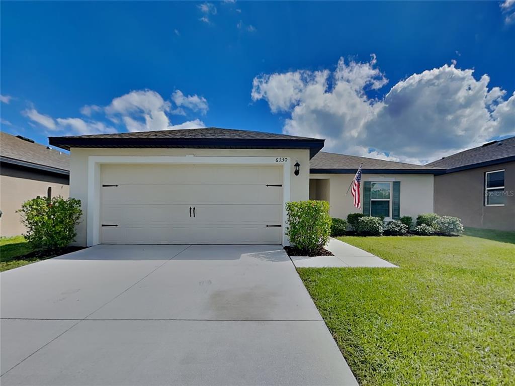 Undisclosed Address Lakeland, FL 33811 - Photo 1 of 17 a front view of a house with garden