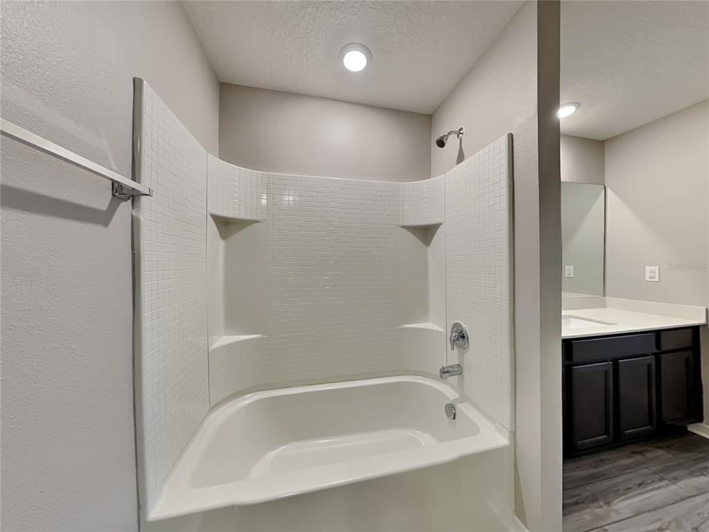 Undisclosed Address Lakeland, FL 33811 - Photo 11 of 17 a white bath tub sitting next to a shower
