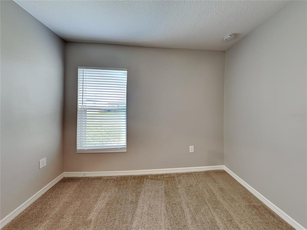 Undisclosed Address Lakeland, FL 33811 - Photo 12 of 17 an empty room with a window