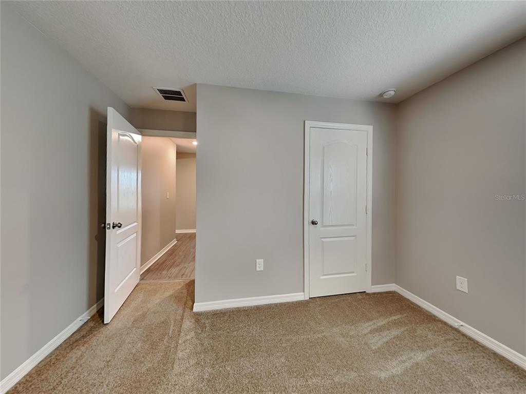 Undisclosed Address Lakeland, FL 33811 - Photo 13 of 17 a view of an empty room and closet area