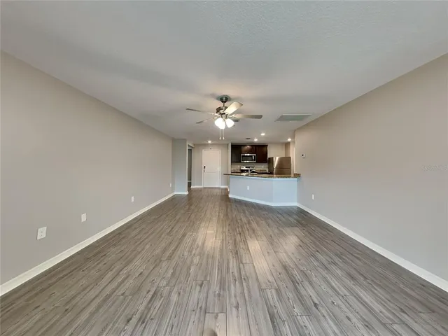 a view of a kitchen with a sink and a stove top oven