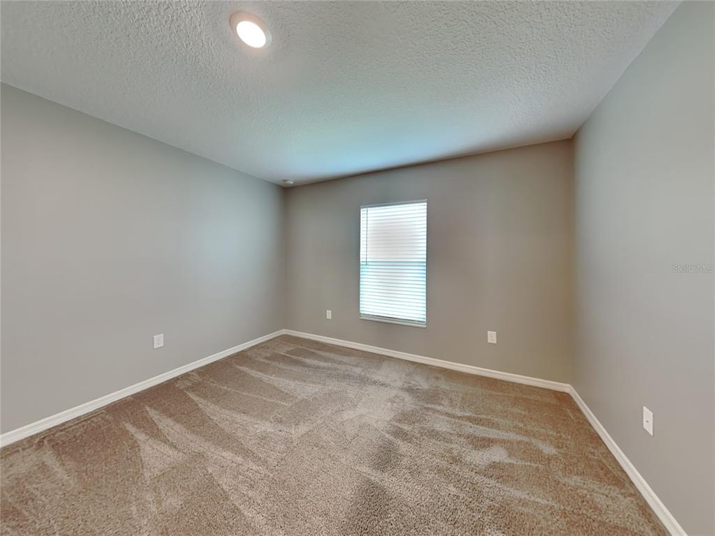 Undisclosed Address Lakeland, FL 33811 - Photo 9 of 17 an empty room with a window