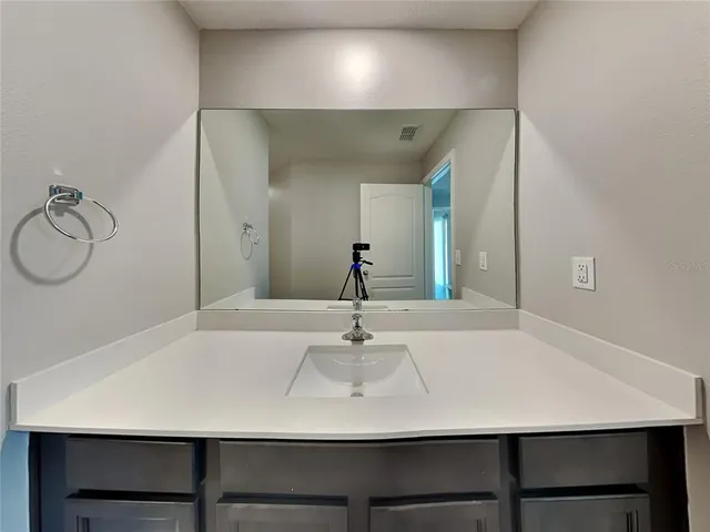 a view of a room with a table and chairs