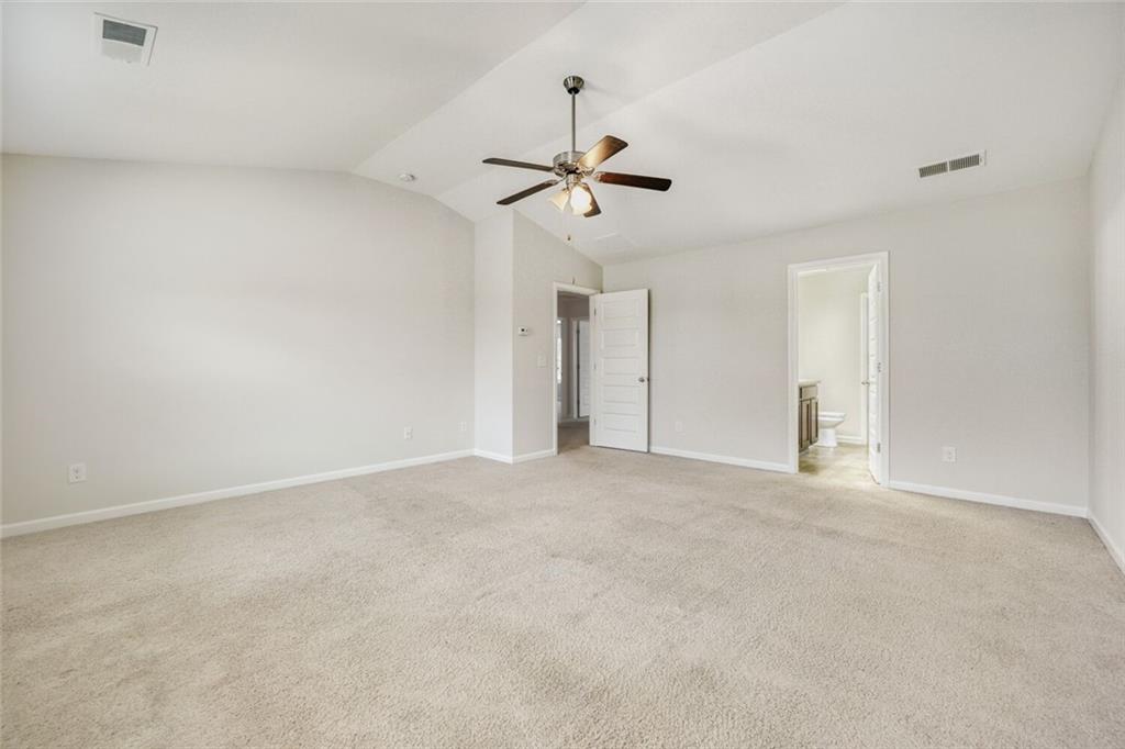 323 Bandelier Circle Hampton, GA 30228 - Photo 16 of 28 a view of an empty room with a ceiling fan