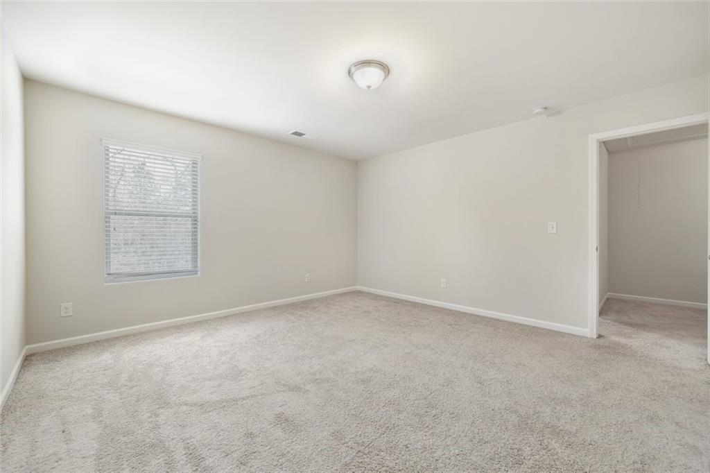 323 Bandelier Circle Hampton, GA 30228 - Photo 18 of 28 an empty room with windows