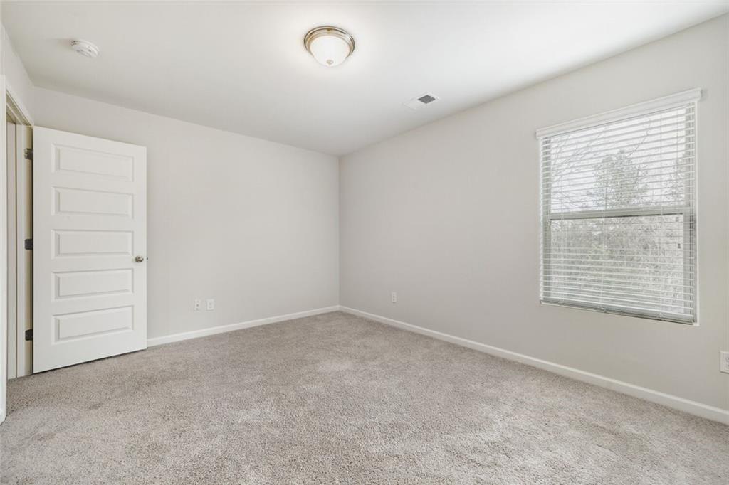 323 Bandelier Circle Hampton, GA 30228 - Photo 20 of 28 an empty room with a window