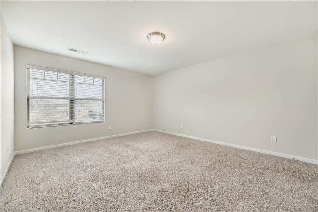 323 Bandelier Circle Hampton, GA 30228 - Photo 21 of 28 an empty room with a window