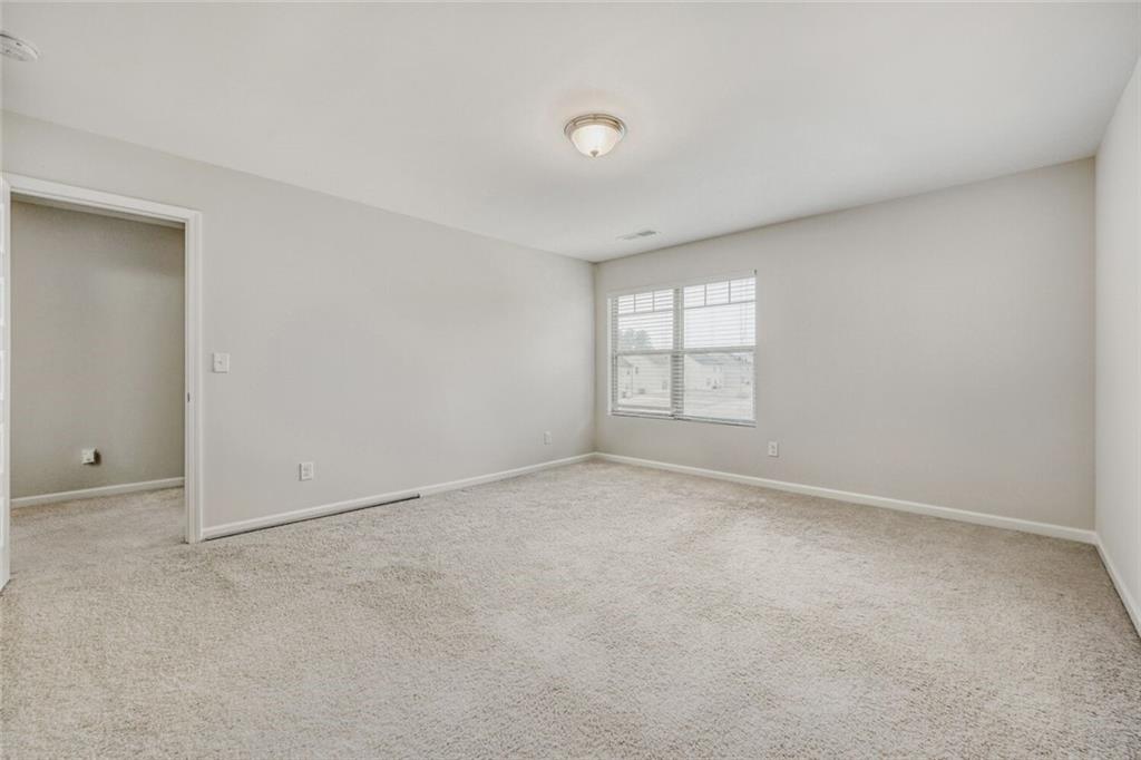 323 Bandelier Circle Hampton, GA 30228 - Photo 22 of 28 an empty room with windows