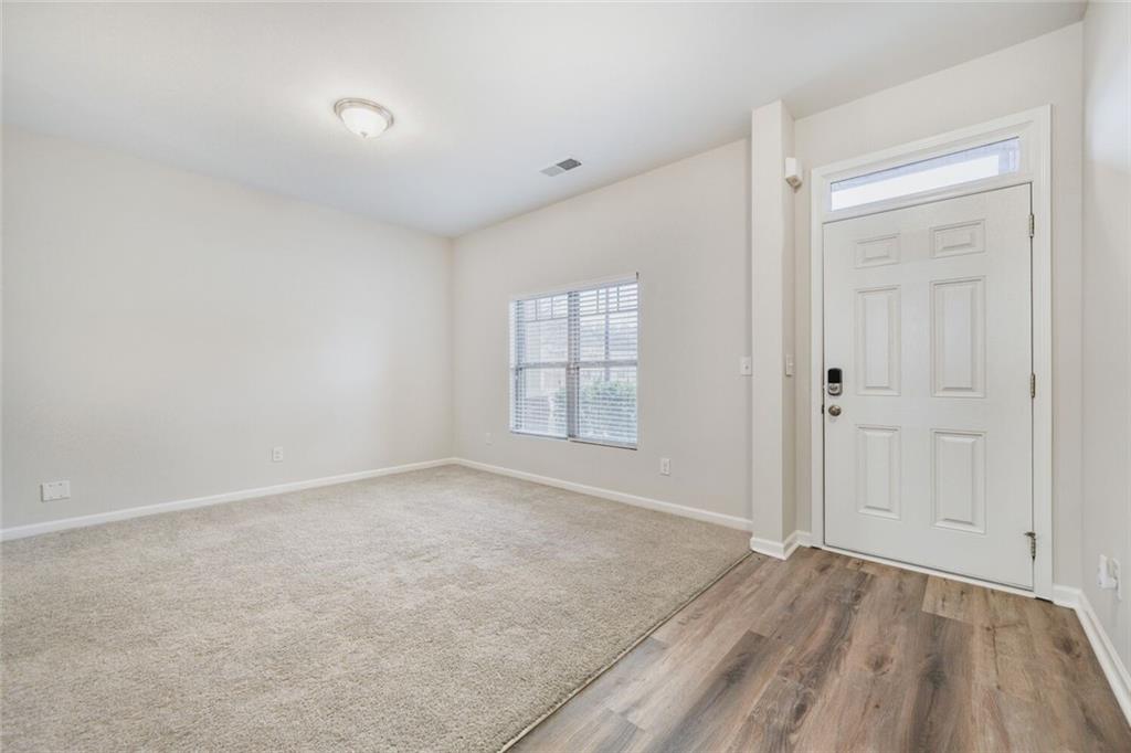 323 Bandelier Circle Hampton, GA 30228 - Photo 4 of 28 a view of an empty room and window