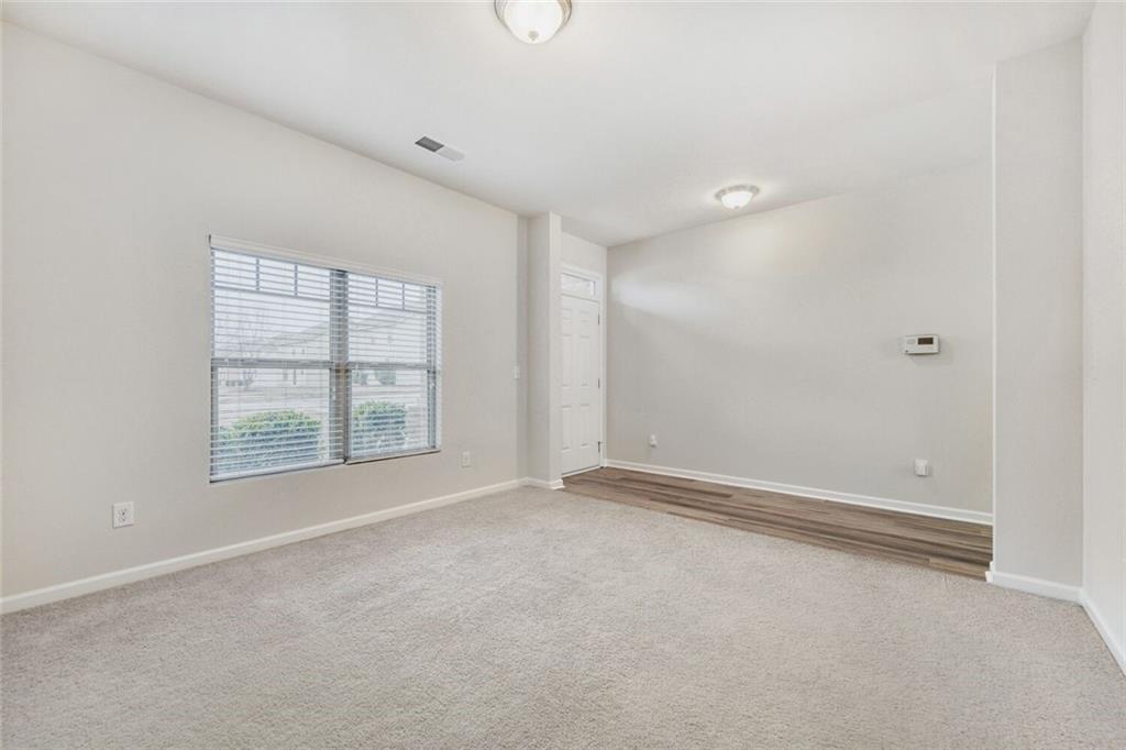 323 Bandelier Circle Hampton, GA 30228 - Photo 5 of 28 an empty room with windows
