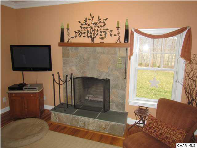 345 Burchs Creek Road Crozet, VA 22932 - Photo 18 of 35 Stone fireplace with raised hearth.
