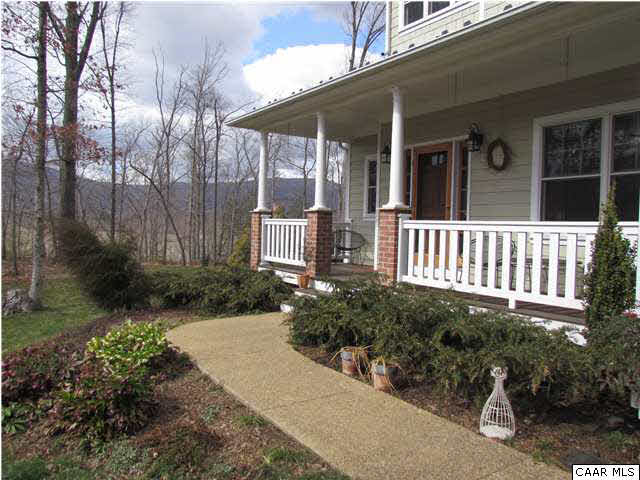 345 Burchs Creek Road Crozet, VA 22932 - Photo 8 of 35 Aggregate walkway leading to covered front porch with Ipe flooring. A beautifil pine front door with side lights.