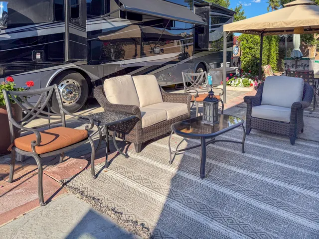 a view of a chairs and table in a patio