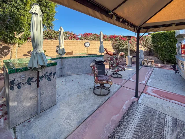 a view of a ocean with furniture