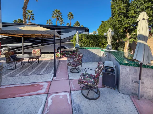 a view of outdoor dining space with chairs