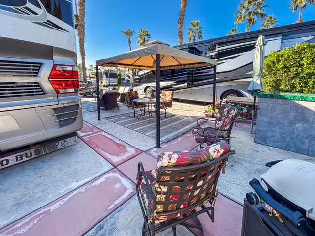a view of a chairs and table in the patio