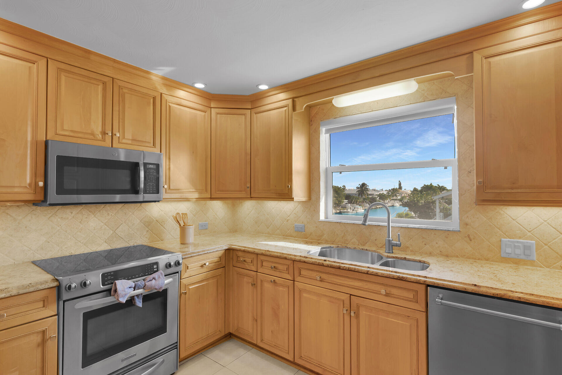 580-590 10th Street Key Colony Beach, FL 33051 - Photo 16 of 75 a kitchen with a sink stove and microwave