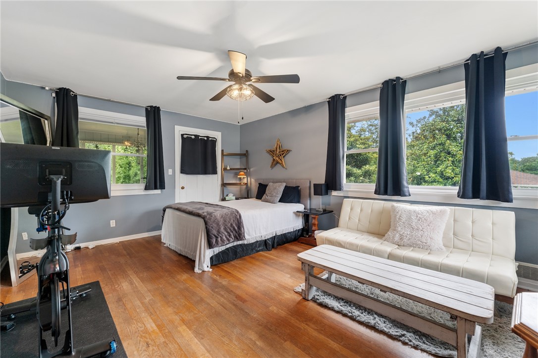 1105 Greenacres Anderson, SC 29621 - Photo 23 of 46 Hardwood floors and a ceiling fan create a comfortable and versatile living space.