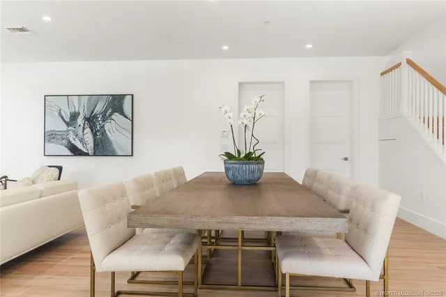 a living room with furniture tv and a large window