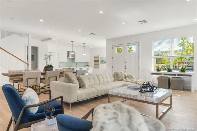 a living room with furniture and a painting