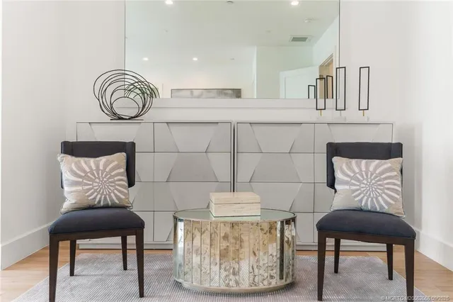 a bathroom with a double vanity sink a toilet and mirror