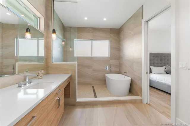 a bathroom with a tub and shower