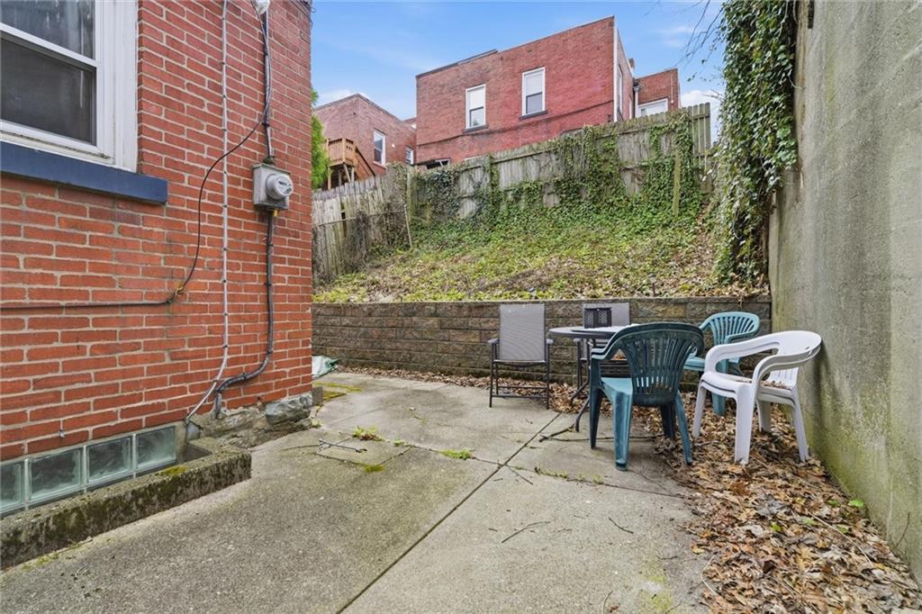 633 Gettysburg Street Pittsburgh, PA 15206 - Photo 15 of 32 a backyard of a house with table and chairs