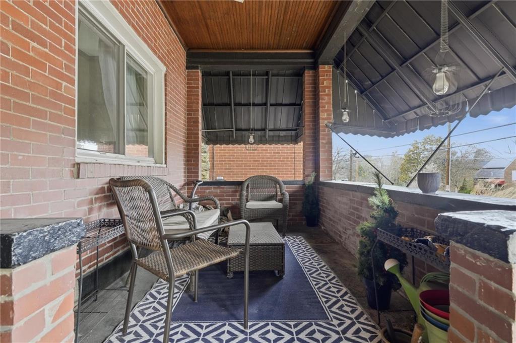 633 Gettysburg Street Pittsburgh, PA 15206 - Photo 27 of 32 a roof deck with table and chairs