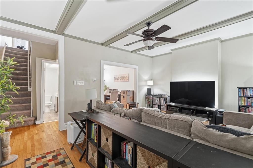 633 Gettysburg Street Pittsburgh, PA 15206 - Photo 3 of 32 a view of a livingroom with furniture and a flat screen tv