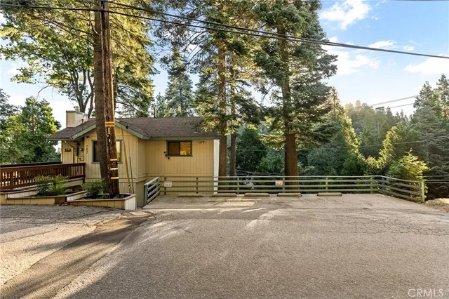 a view of a house with a large tree