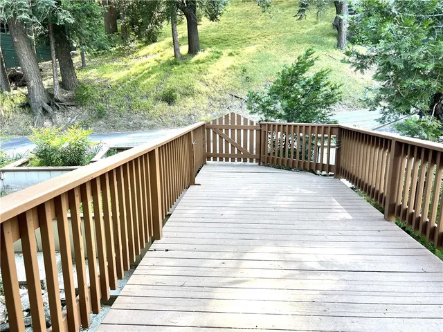 a balcony with trees in the back yard