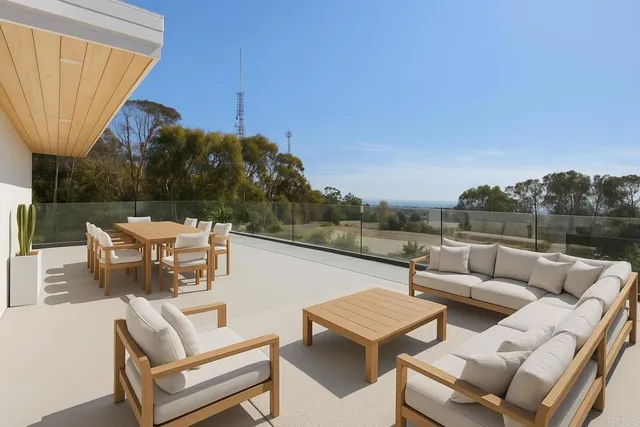 a bedroom with a large bed and a large window