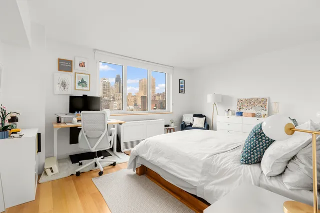 a bathroom with a sink mirror vanity and toilet