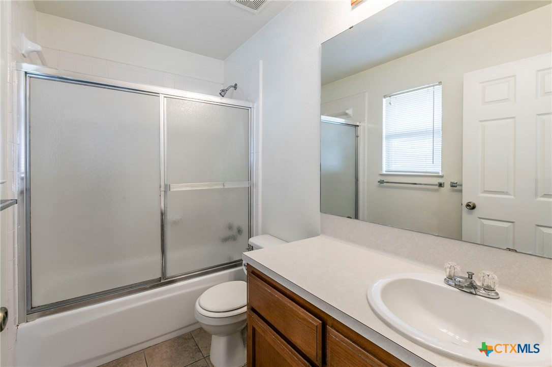 1001 Cherokee Trail Kempner, TX 76522 - Photo 8 of 18 a bathroom with a sink toilet and shower