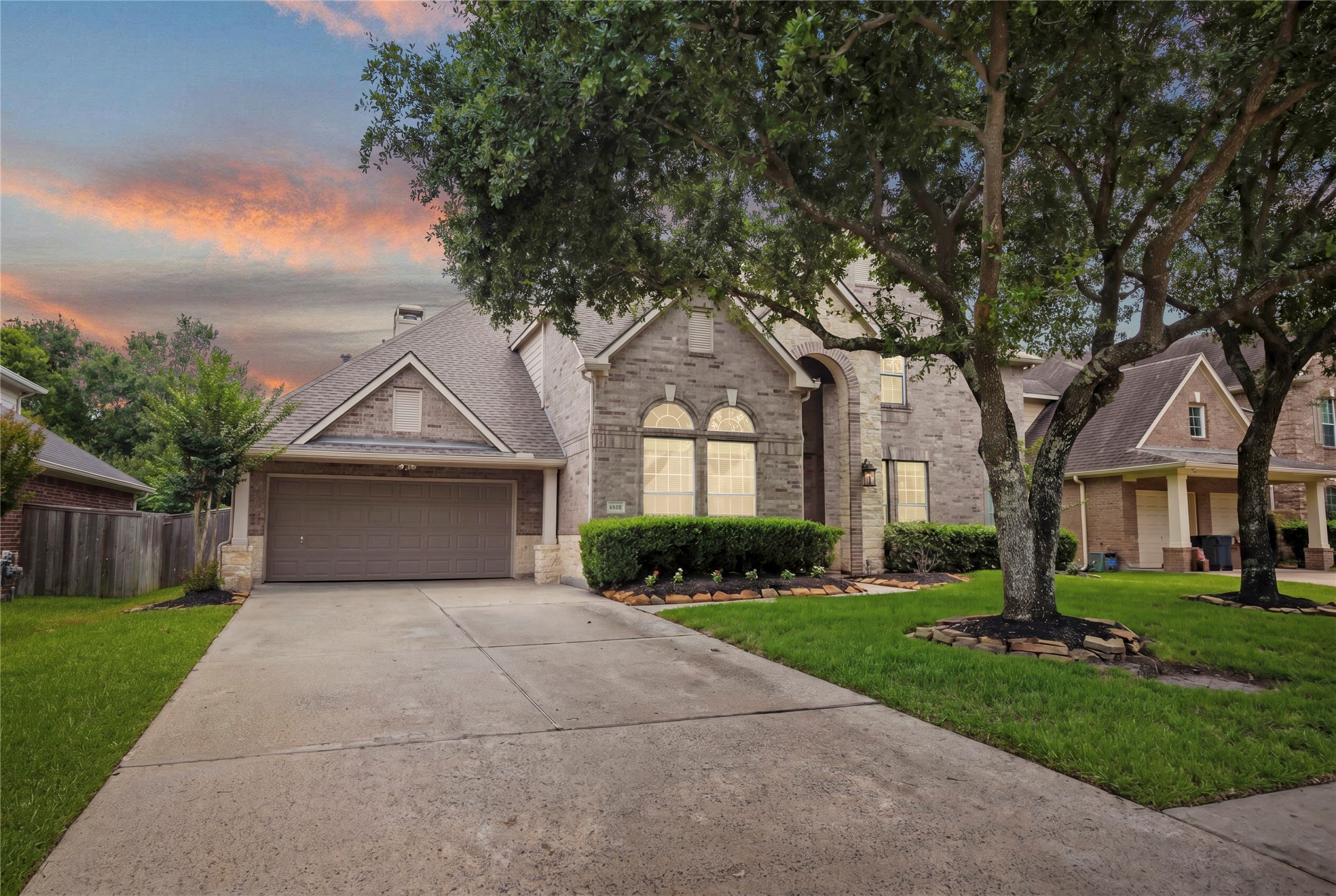 14718 Ramblebrook Humble, TX 77396 - Photo 38 of 38 As the home settles into twilight, the front elevation leaves a lasting impression. The photos show the spaces — the visit shows how well this home actually lives.