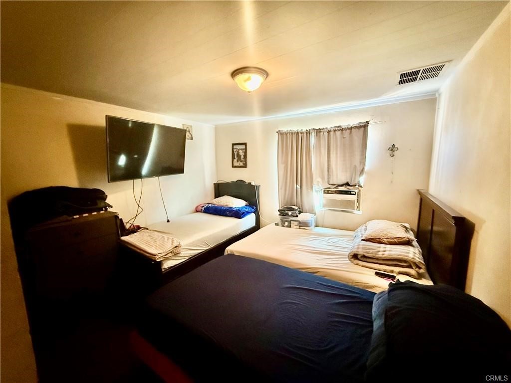 12700 Elliot, Unit 456 El Monte, CA 91732 - Photo 14 of 37 a bedroom with a bed and couch