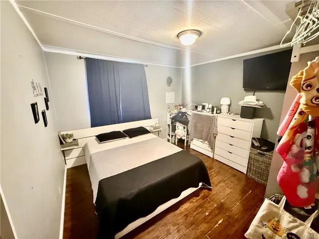 a bedroom with a bed and a table