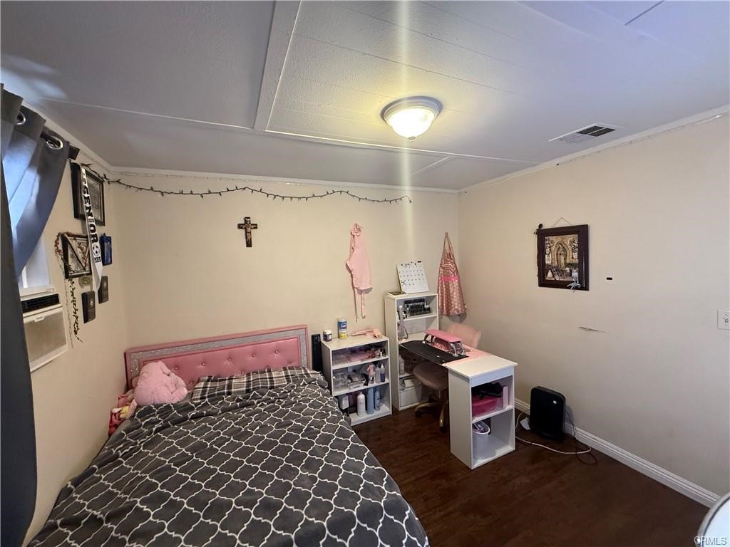 12700 Elliot, Unit 456 El Monte, CA 91732 - Photo 20 of 37 a bedroom with a bed and a desk