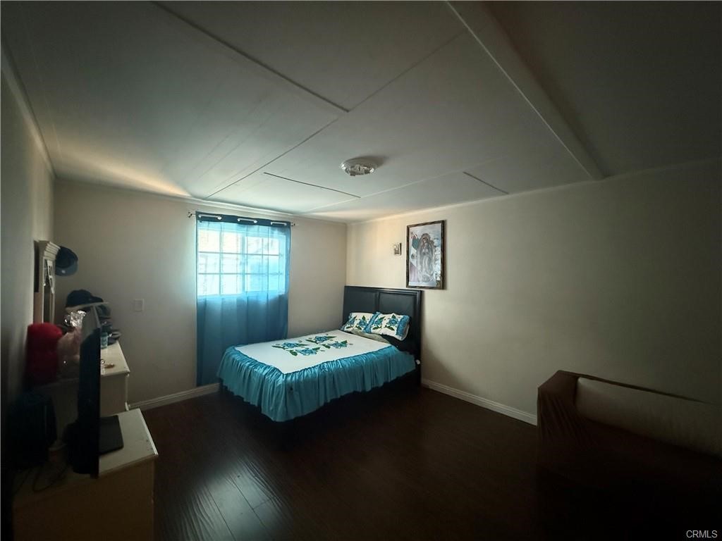 12700 Elliot, Unit 456 El Monte, CA 91732 - Photo 21 of 37 a bedroom with a bed and a window