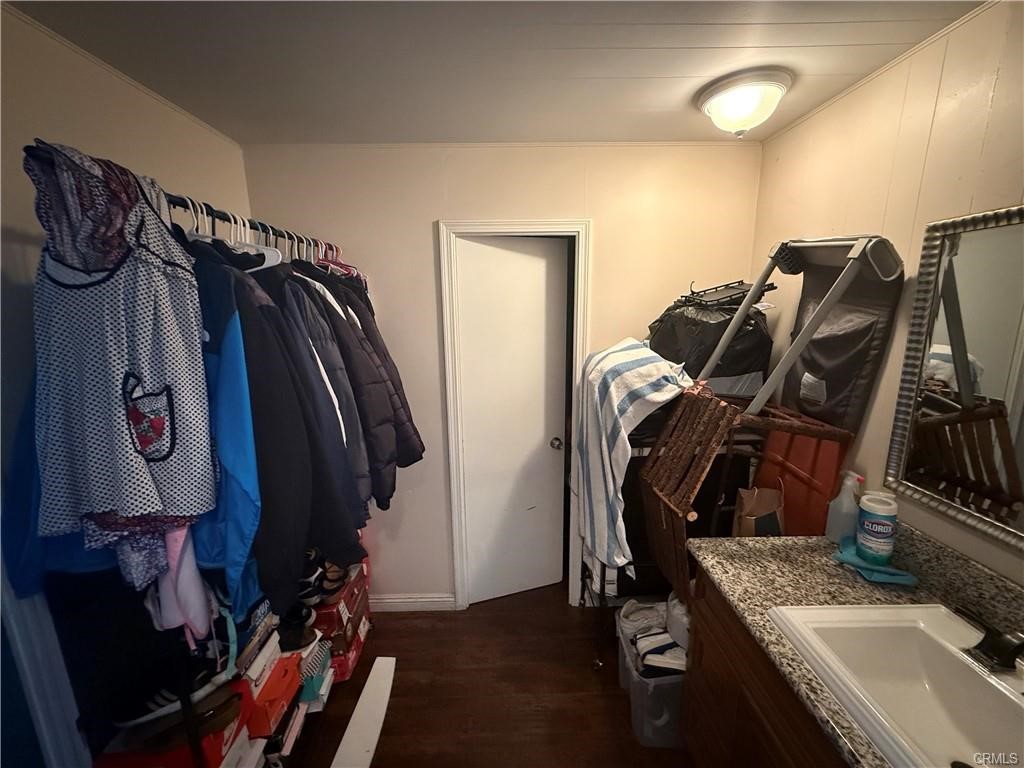 12700 Elliot, Unit 456 El Monte, CA 91732 - Photo 24 of 37 a view of walk in closet with clothes and shoes