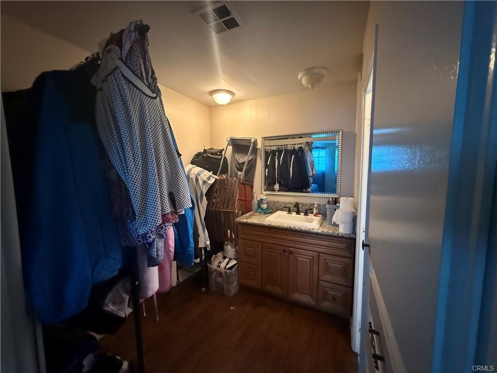 12700 Elliot, Unit 456 El Monte, CA 91732 - Photo 25 of 37 a view of walk in closet with clothes and shoes