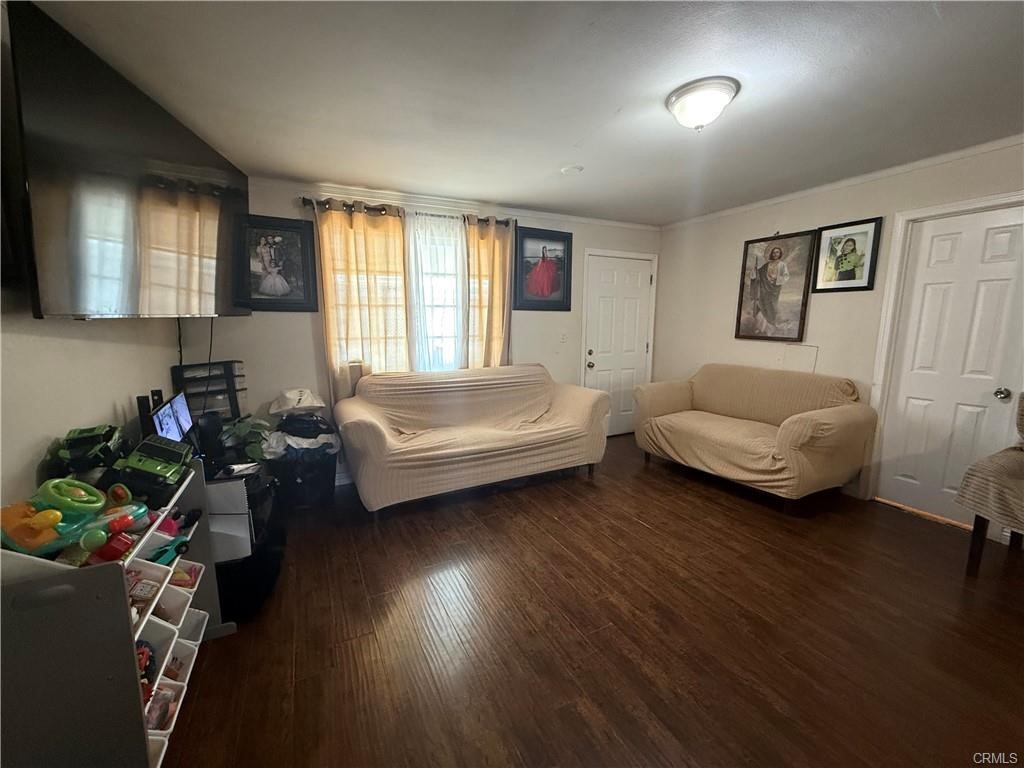 12700 Elliot, Unit 456 El Monte, CA 91732 - Photo 31 of 37 a living room with furniture and a wooden floor