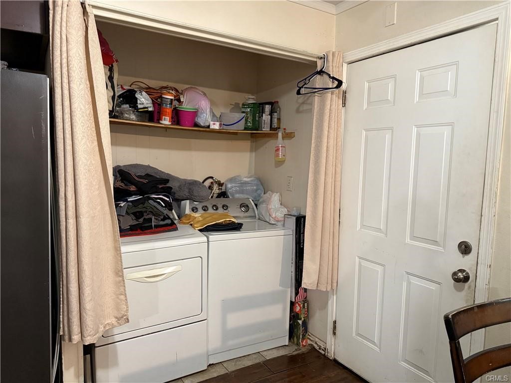 12700 Elliot, Unit 456 El Monte, CA 91732 - Photo 34 of 37 a view of walk in closet with clothes and shoes