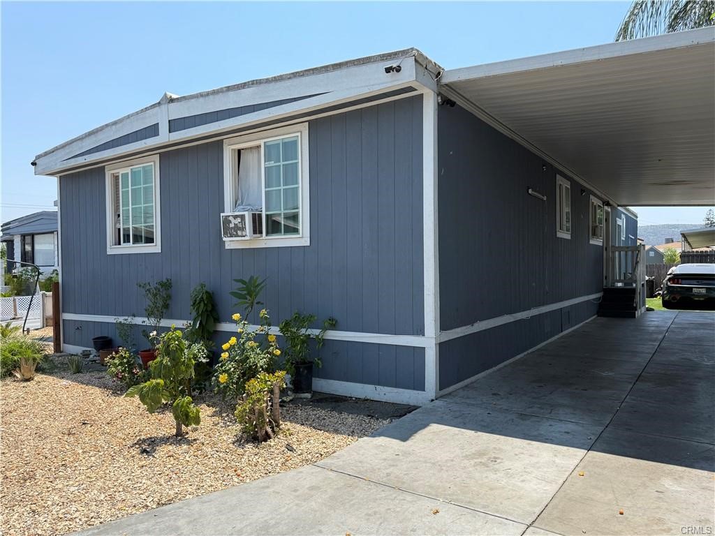 12700 Elliot, Unit 456 El Monte, CA 91732 - Photo 7 of 37 a backyard of a house with potted plants