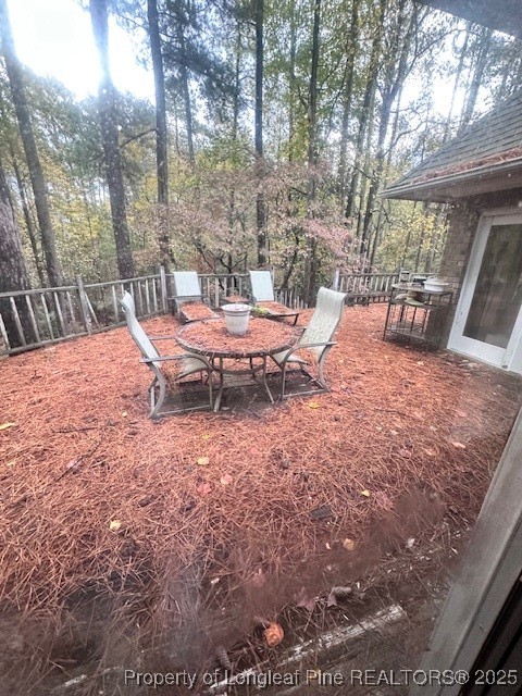 36 Edinburgh Lane Pinehurst, NC 28374 - Photo 3 of 4 a view of a backyard with sitting area